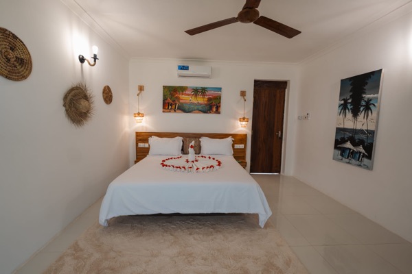 Deluxe room with flower petal heart decoration
